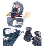 A HJC motorcycle helmet, boxed, with carry bag and gloves.