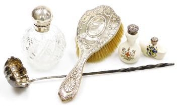 A group of silver, a silver topped cut glass scent bottle, of globular form, the lid monogrammed, Bi