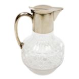 A Victorian cut glass claret jug, with silver mounted handle and hinged lid, Horace Woodward & Compa