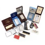 A group of cigarette lighters, to include Colibri lighter in gold coloured and black simulated croco