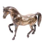 A silver plated figure of a prancing horse, 24.5cm wide.