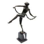After Pierre Le Faguays (French 1882-1962). Bronze figure of a nude female dancer holding a rose ga