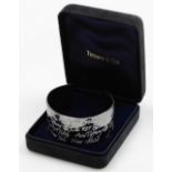 A cuff bangle, with white enamel engraved decoration, repeating '127 5th Avenue New York', and New Y