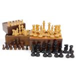 A Staunton type chess set, mahogany boxed, further chess set, wooden boxed, and an empty chess set b