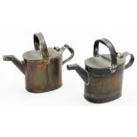 A pair of copper watering cans, 30.5cm wide.