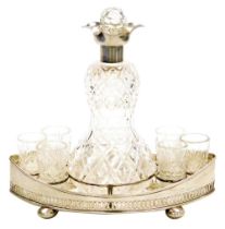 An Edward VII cut glass and silver liqueur set, the gourd shaped decanter with silver mount and cut