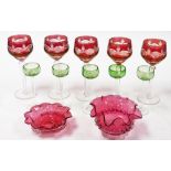 A set of five Continental ruby flash glass stemmed wine glasses, two cranberry glass dishes, and fiv