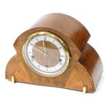 An Art Deco walnut and inlaid sunburst mantel clock, the circular dial with silver chapter ring bear