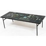 A mid century tile top coffee table, set with twenty four abstract black ground tiles, raised on bra