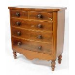 A Victorian mahogany bow front chest, of two short over three long graduated drawers, above a shaped