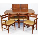 A 1960's teak dining table and chairs, possibly Meredew, the draw leaf table with two additional lea
