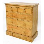 A Victorian pine chest, of two short over three long graduated drawers, raised on a plinth base, 103