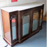 A Victorian walnut and marble topped breakfront sideboard, the mirrored front having two doors openi