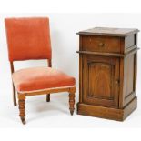 A Victorian walnut nursing chair, upholstered in red Draylon, raised on turned legs, together with a