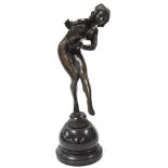After Claire Colinet (French, 1880-1950). A bronze figure of the dancer, raised on a serpentine base