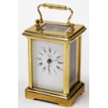 A 20thC brass carriage clock, retailed by Cope, enamel dial bearing Roman numerals, single barrel mo