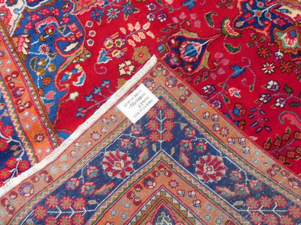 A Persian Tabraz carpet, on a red ground, 285cm x 185cm. - Image 3 of 3