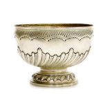 A Victorian silver fruit bowl, of semi spiral fluted and fruited form, makers name worn, London 1895