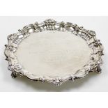 An Edward VII silver salver, with piecrust border decorated with squirrels, shells, bearing presenta