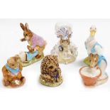 Six Beatrix Potter figures, comprising Anna Maria, Mr Drake Puddle-Duck, Mr Benjamin Bunny and Peter