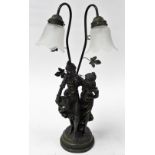 A bronze patinated plaster figural table lamp, modelled as two standing female figures, two branch s
