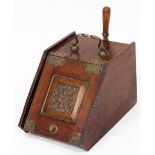 A Victorian oak and brass bound coal scuttle, with lead liner and shovel, 39cm deep.