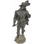 A late 19thC spelter figure of Don Juan, model standing holding a sword, raised on a circular base,