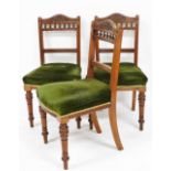 A set of three Victorian walnut dining chairs, with overstuffed seats, raised on turned legs.