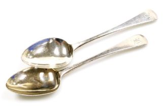 A pair of George III silver Old English pattern serving spoons, each with monogram to handle, London