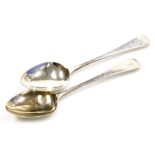 A pair of George III silver Old English pattern serving spoons, each with monogram to handle, London