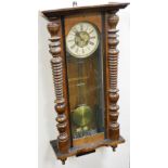 A late 19thC Continental walnut cased wall clock, circular brass dial with chapter ring bearing Roma