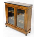 A Victorian walnut and inlaid pier cabinet, with a pair of glazed doors opening to reveal two shelve