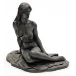 Roland Chadwick. A bronze finished resin figure of a naked lady, model seated on a sheet, 29.5cm wid