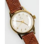 A Cyma 9ct gold gentleman's wristwatch, engine turned circular silver dial, bearing Arabic numerals,