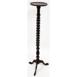 A Victorian oak touchere, with a circular top raised on a spiral twist and baluster turned c