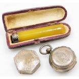 A faux amber cheroot holder, silver capped, cased, together with a silver hexagonal pill box with en