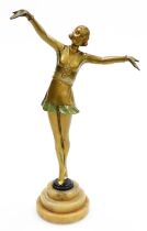 An Art Deco painted spelter figure, modelled as a standing lady in a short dress with her arms outst