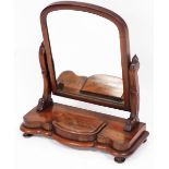 A Victorian mahogany swing frame toilet mirror, raised on scroll ends above a serpentine base with h