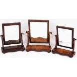 A Victorian mahogany swing frame toilet mirror, raised on a serpentine base on bun feet, 53cm high,