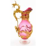 A Fin de Sicle clear and cranberry glass jug, with gilt metal mounts, of baluster form, with a styli