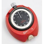 An Omega Meister stopwatch, and a plastic stand.