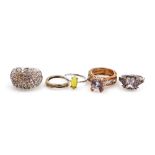 Five various dress rings, comprising an imitation diamond and amethyst set cluster ring, imitation o