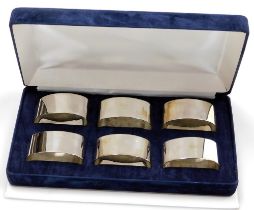 A set of six Elizabeth II silver napkin rings, of oval plain form, Sheffield 1998, 6¼oz, in fitted b