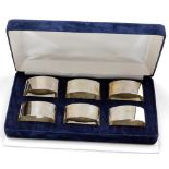 A set of six Elizabeth II silver napkin rings, of oval plain form, Sheffield 1998, 6¼oz, in fitted b