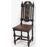 A Victorian 17thC style oak dining chair, the crest rail and splay carved with leaves, with studded