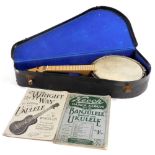 A ukulele banjo, cased together with the Wright Way to Learn the Ukulele by C E Wheeler, and the Kee