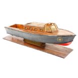 A wooden scale model of a vintage naval patrol boat, raised on a wooden stand, 79cm wide.