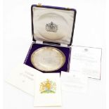 An Elizabeth II silver salver, with a raised bead border, the centre engraved with the Queen's coat