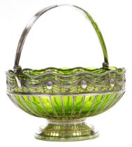An early 20thC WMF silver plated basket, with an inset pale green glass bowl, pierced and embossed w