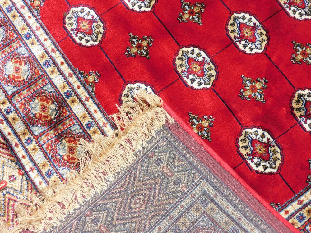 A Bokara Cashmere rug, on red ground with all over design, 170cm x 120cm. - Image 3 of 3